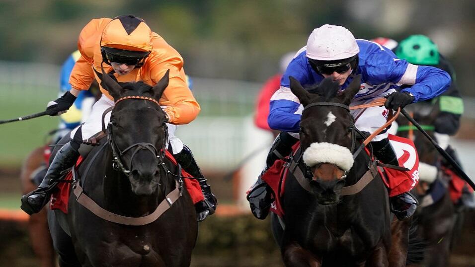 Harry Cobden riding Malaya (blue silks) 